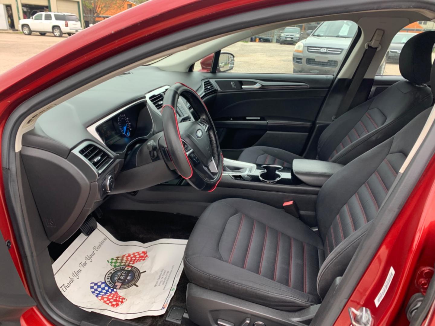 2015 Maroon /Black Ford Fusion SE (3FA6P0H95FR) with an 2.0L L4 DOHC 16V engine, Automatic transmission, located at 1830 North Belt Line Road, Irving, TX, 75061, (469) 524-0199, 32.834373, -96.993584 - Photo#8